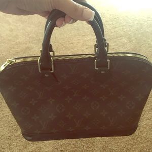 Louis Vuitton Brown monogram with black trim.